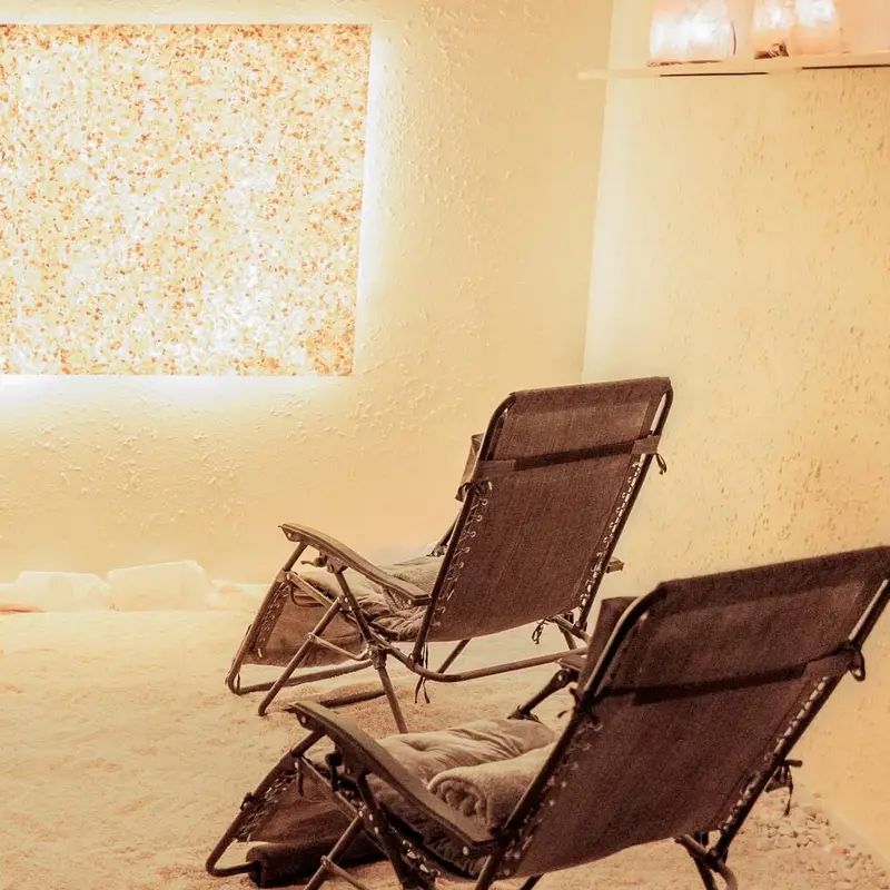 The backlit salt wall in the salt room at Salt Cove Spa