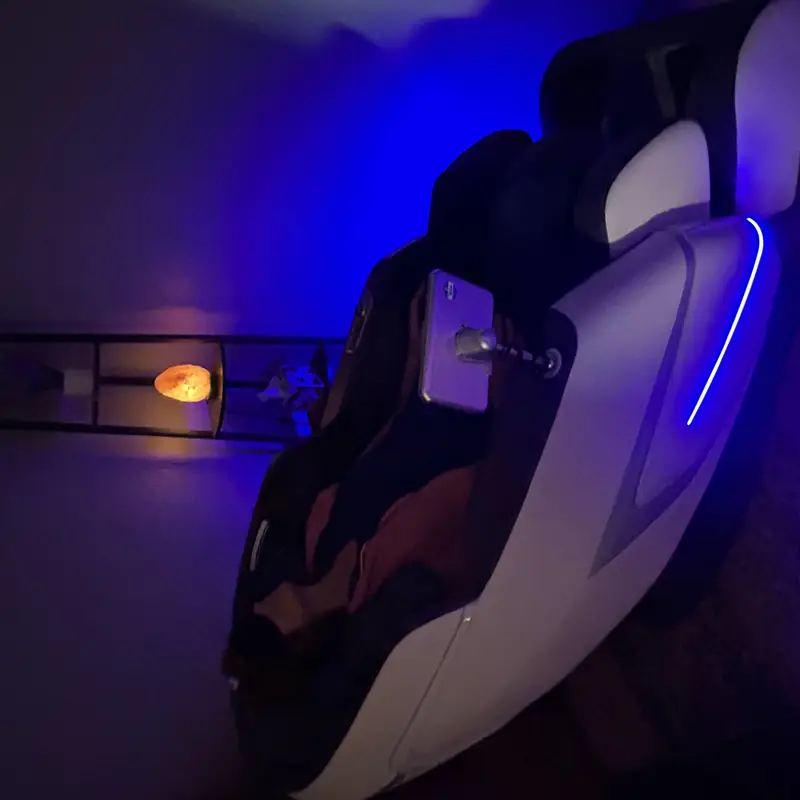 A reclining massage chair at Salt Cove Spa under soft blue light